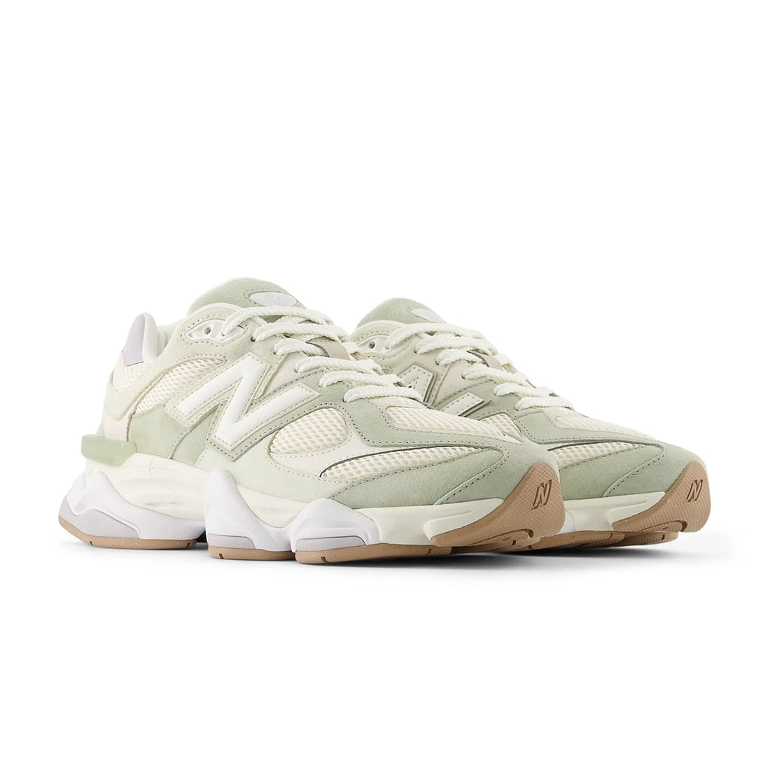 9060 Pearl Grey sneaker featuring breathable mesh upper in soft grey tones, suede overlays, chunky cushioned sole, and modern Y2K-inspired design.