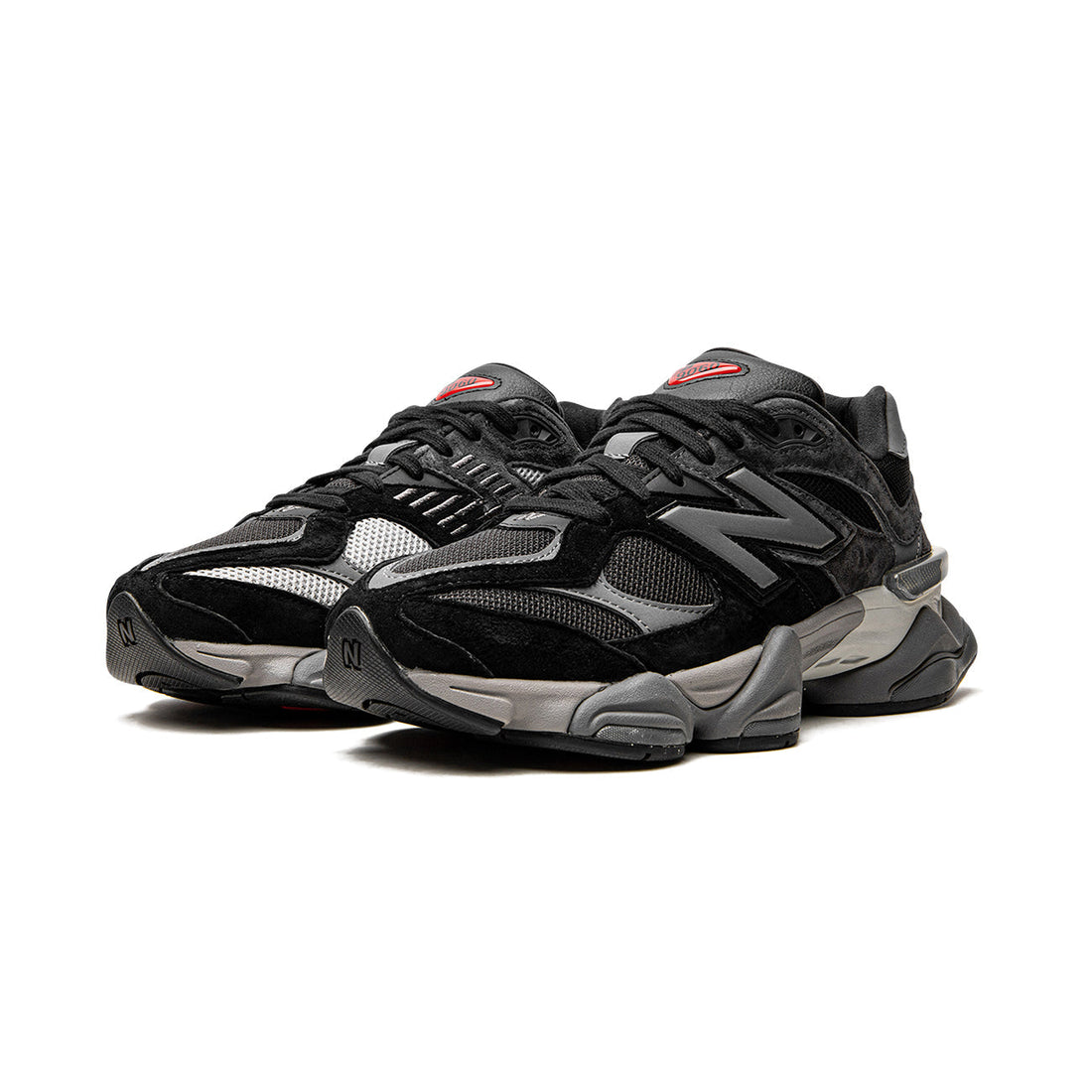 9060 Black Castlerock sneaker featuring breathable mesh upper in black and grey tones, suede overlays, chunky cushioned sole, and modern Y2K-inspired design. 