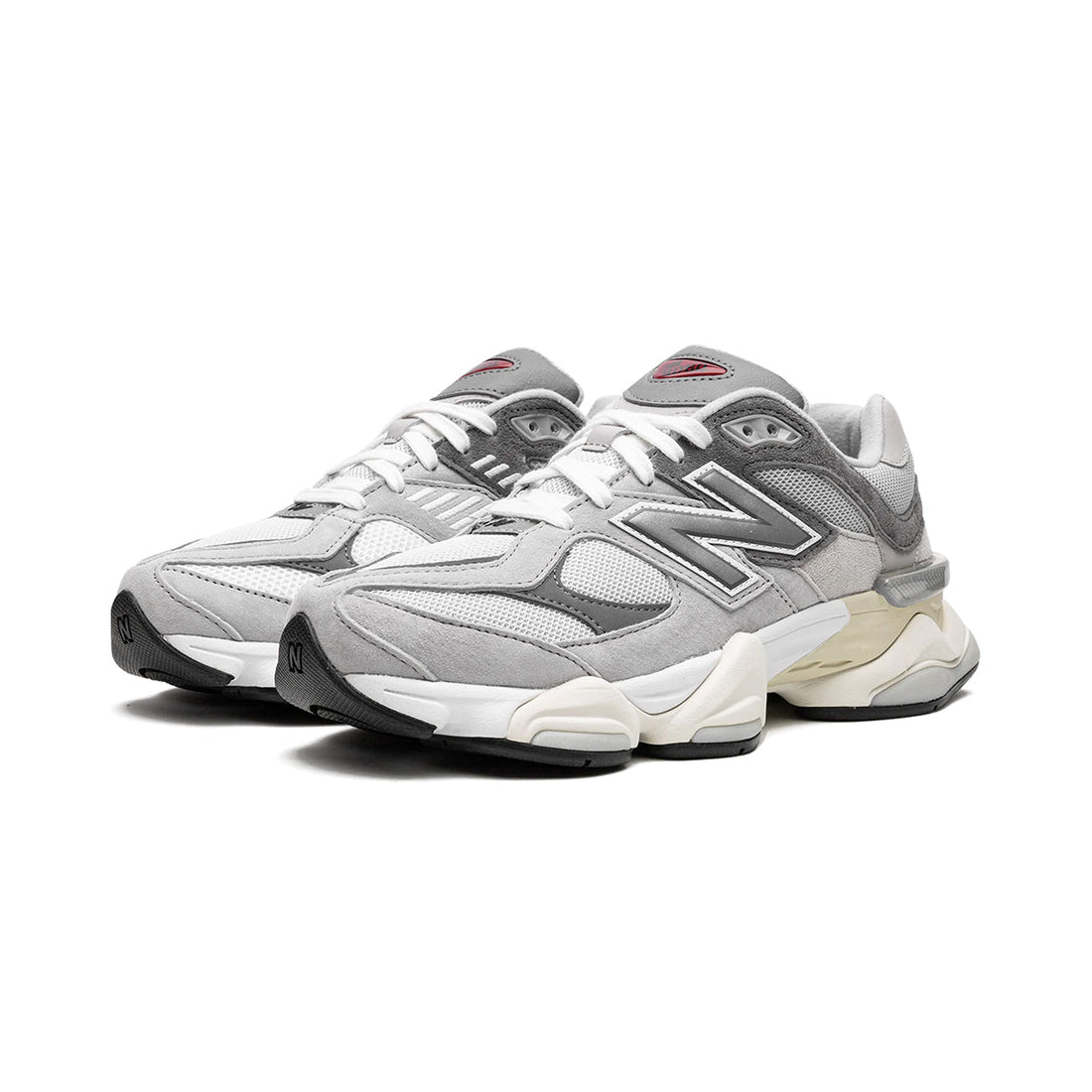 9060 Grey sneaker featuring breathable mesh upper in neutral grey tones, suede overlays, chunky cushioned sole, and modern Y2K-inspired design.