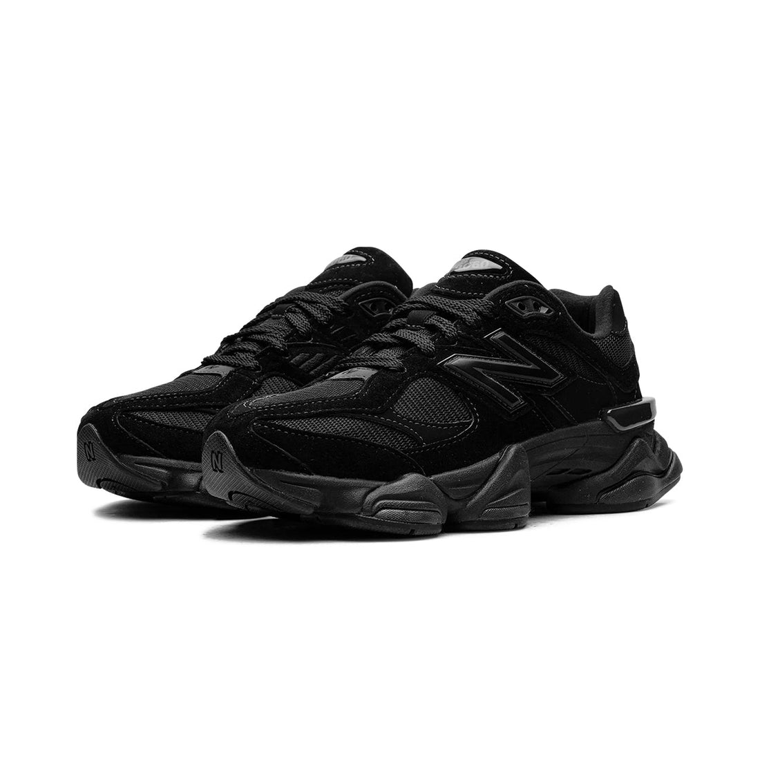 9060 Triple Black sneaker featuring breathable mesh upper in all-black tones, suede overlays, chunky cushioned sole, and modern Y2K-inspired design.