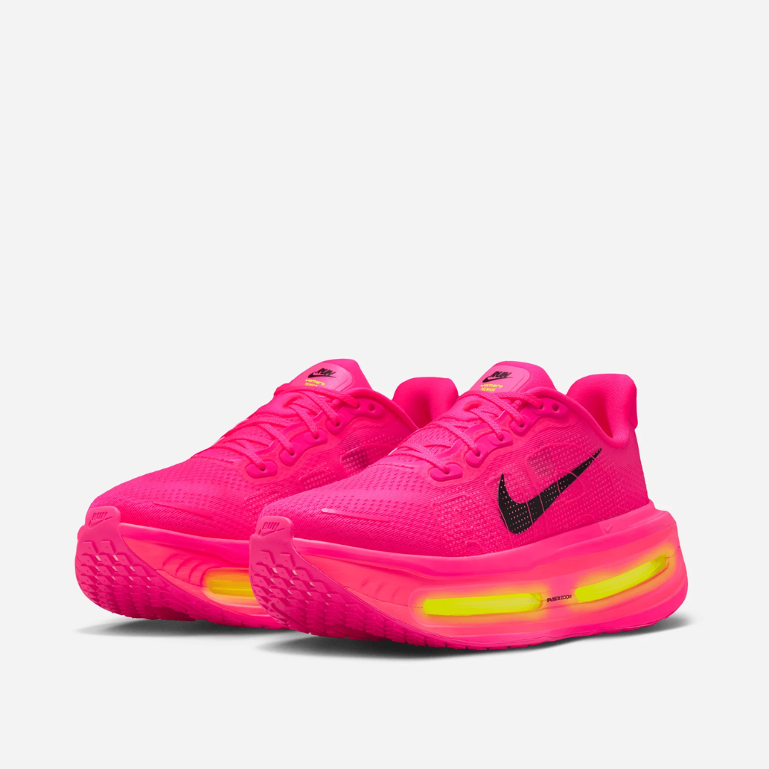 Vomero Premium Hyper Pink sneaker featuring breathable mesh upper in vibrant pink tones, cushioned sole with visible Air units, and modern performance-inspired design.