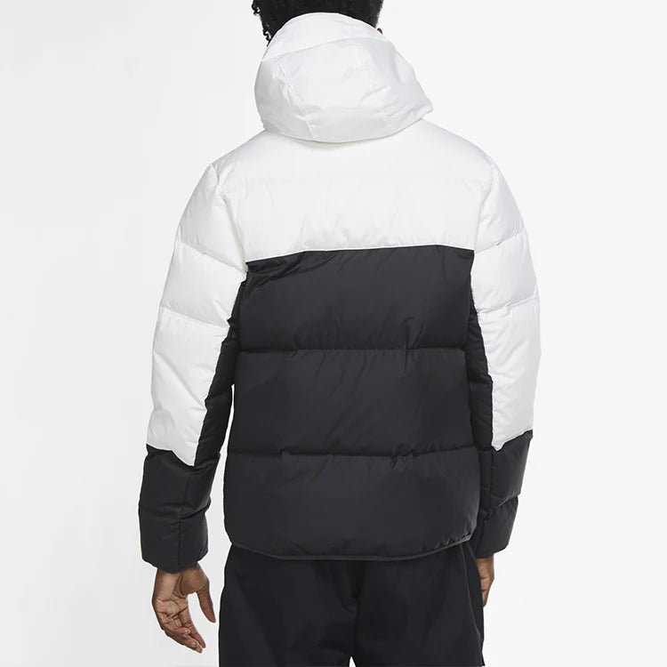 Man wearing white shield coat - wind- and water-resistant full-zip outer jacket with hood, designed for cold weather protection and modern urban style.