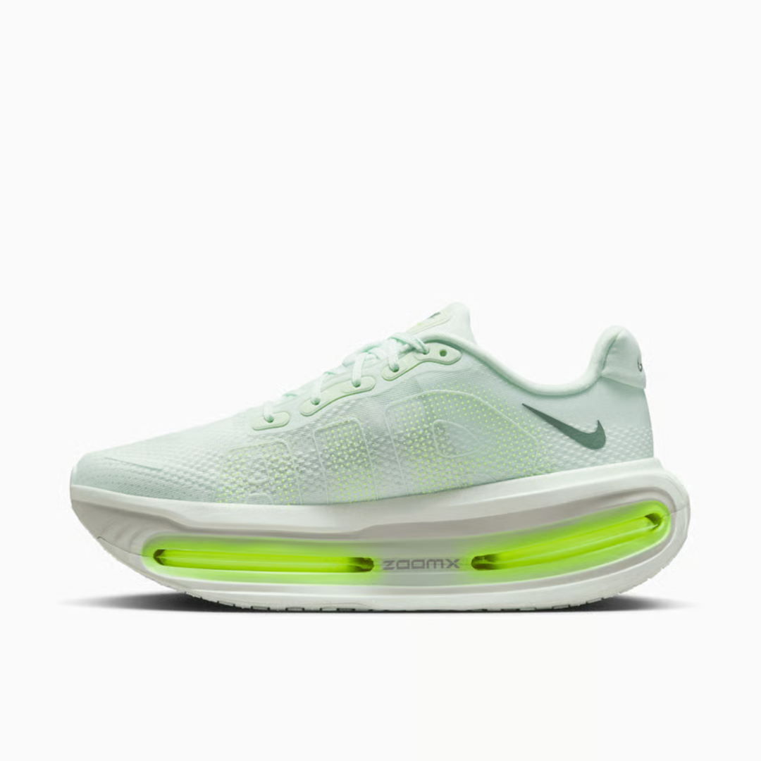 Vomero Premium Barely Volt sneaker featuring breathable black mesh upper, bright volt green accents, cushioned sole with visible Air units, and modern performance-inspired design.