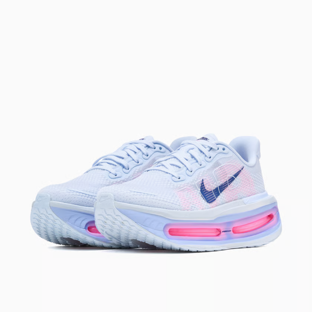 Vomero Premium Blue Tint sneaker featuring breathable mesh upper in light blue tones, cushioned sole with visible Air units, and modern performance-inspired design.