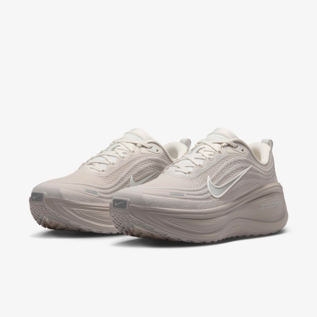 Air Zoom Vomero Plus Light Bone sneaker featuring breathable mesh upper in light beige tones, ZoomX and ReactX cushioning, and modern running-inspired design for everyday comfort.