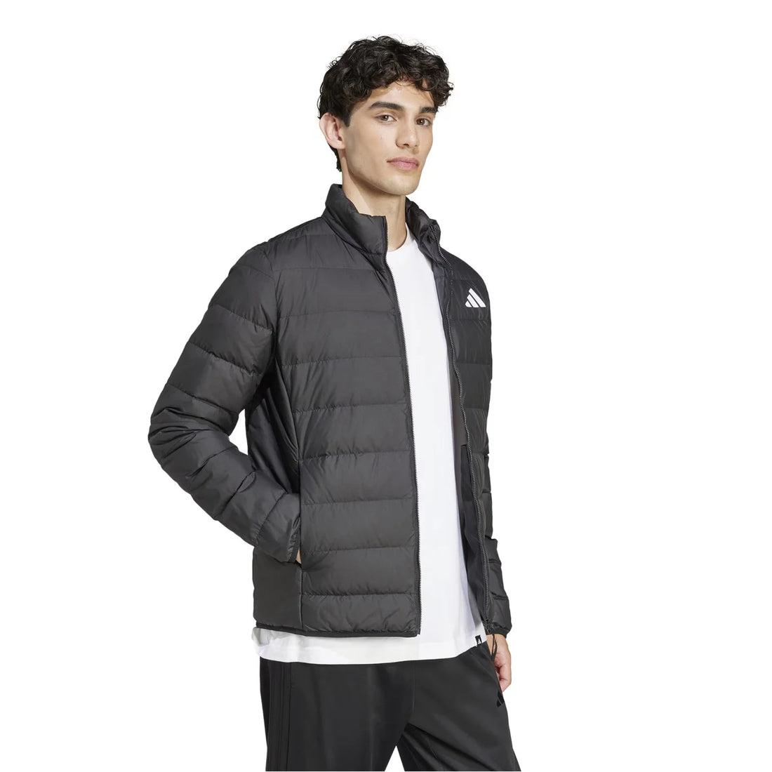 Man wearing black adidas Essentials Light Down Jacket, front view, slim fit down jacket with zip closure and stand-up collar