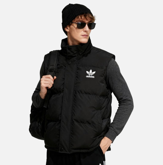 Men wearing black adidas puffer vest with white Trefoil logo, front view