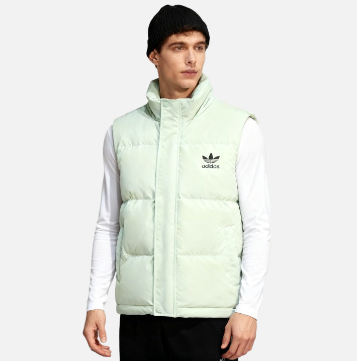 Men wearing black adidas puffer vest with white Trefoil logo, front view