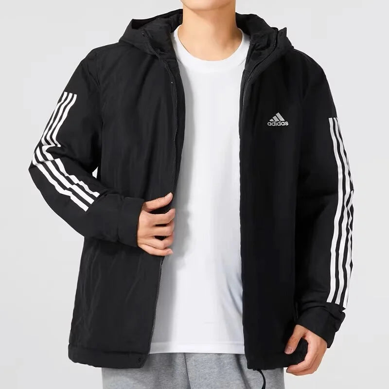 Man wearing black down jacket with hood — h igh-fill insulation, hooded design, and casual style for cold weather protection