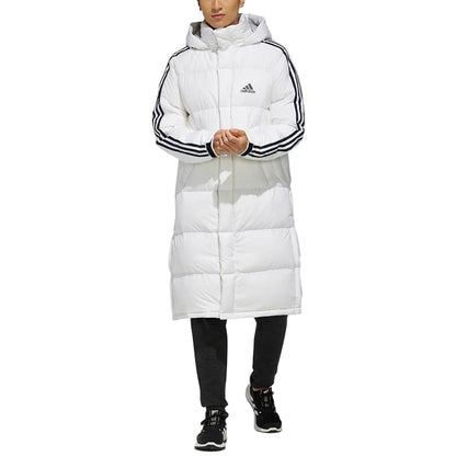 Man wearing a long-length down coat with hood and 3-Stripes branding — premium insulated parka jacket in White for cold weather protection.