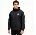 Men wearing black adidas hooded windbreaker with subtle stripe detail on sleeves
