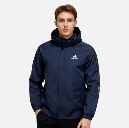 Men wearing navy adidas hooded windbreaker jacket, front view