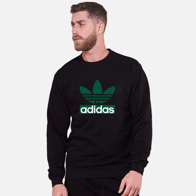 Men wearing black adidas vintage Trefoil sweatshirt, front view