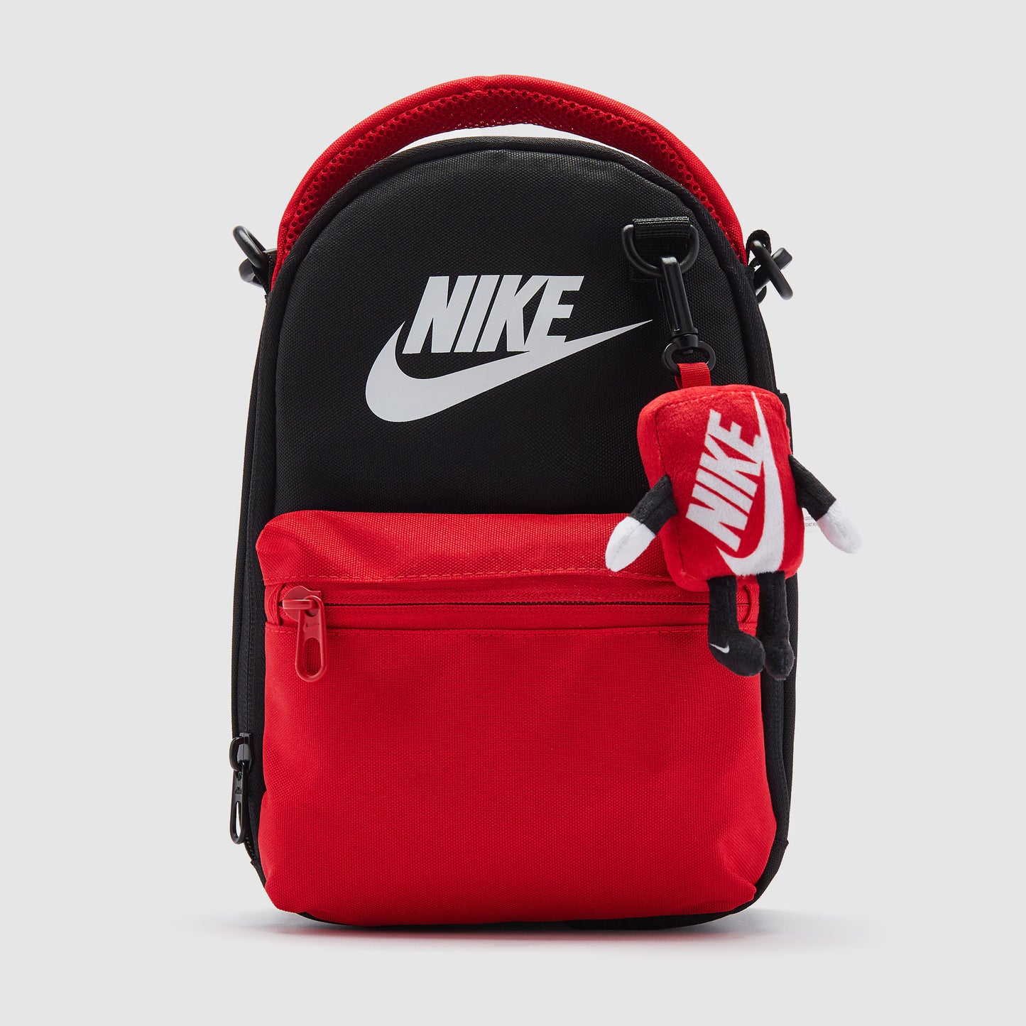 Nike Sportswear Kids Buddies Lunch Tote in black with zip closure and adjustable strap.