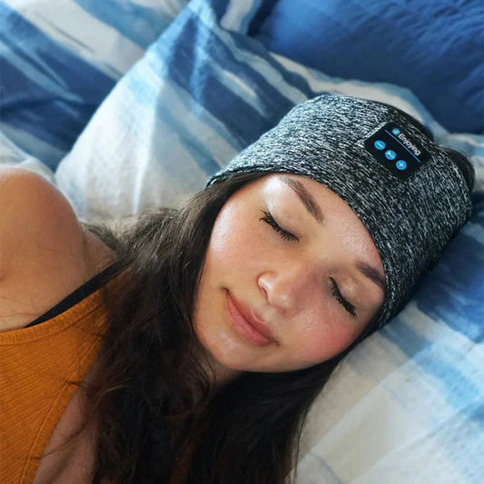 This Bluetooth sleep mask combines comfort with technology, offering a cozy headband design with built-in speakers. Ideal for listening to music or podcasts without the hassle of wires, it provides a peaceful sleep environment. The adjustable strap ensures a snug, comfortable fit. Perfect for travel, meditation, or relaxation, it blocks out light and provides soothing sound. Rechargeable and easy to use, it enhances your sleep experience.