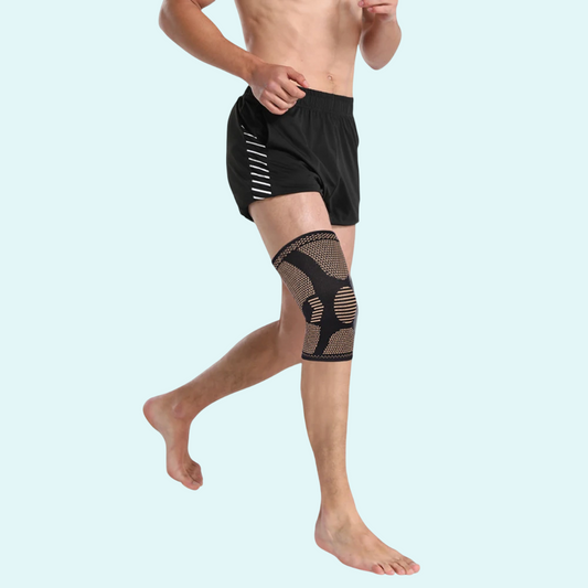 This black and beige knee brace offers support and compression for knee pain and injury recovery. Made with breathable elastic fabric for comfort during movement. The ergonomic design provides targeted support, reducing pressure on the knee. Ideal for athletes or active individuals. Available in multiple sizes for a custom fit.