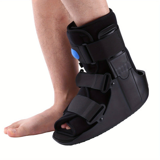 Orthopedic walking boot for foot or ankle injuries, shown on a right leg.
Features a black hard-shell frame with open toe and rocker bottom sole.
Three adjustable Velcro straps ensure a secure, customized fit.
Built-in air bladder with visible blue valve provides extra compression.
Ideal for fractures, sprains, post-surgery recovery, and immobilization.