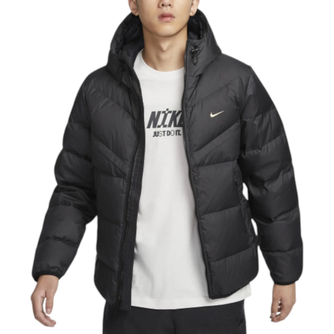 Man wearing Nike Windrunner Storm-FIT Jacket in black – hooded full-zip jacket with wind- and water-resistant shell and sleek urban design.