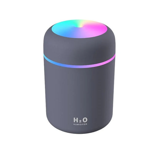 This compact and stylish portable air humidifier features a sleek design with an RGB color-changing top. Perfect for on-the-go, it disperses a fine mist to improve air quality and provide soothing aromatherapy. Ideal for use in small spaces, the portable design and LED lighting make it perfect for bedrooms, offices, or travel. Enjoy a refreshing, fragrant atmosphere wherever you go.