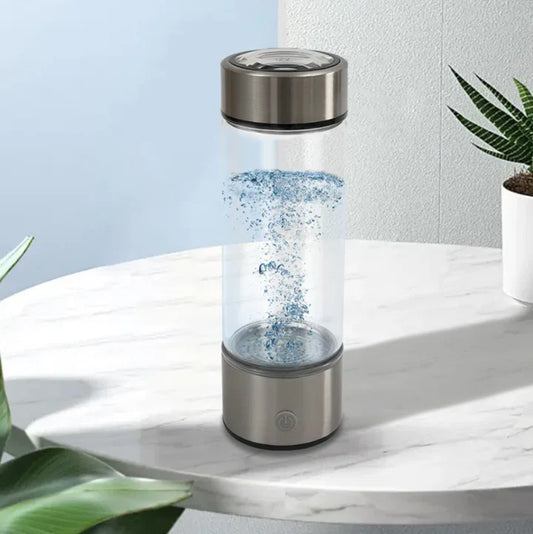 This hydrogen water bottle uses electrolysis technology to enhance the water with hydrogen molecules, promoting better hydration. The sleek design features a durable stainless steel bottom and a clear glass body. It creates bubbles in the water, helping to boost energy and improve overall wellness. The bottle is easy to use with a simple one-button operation and a rechargeable battery. Ideal for those seeking a healthier way to hydrate throughout the day.