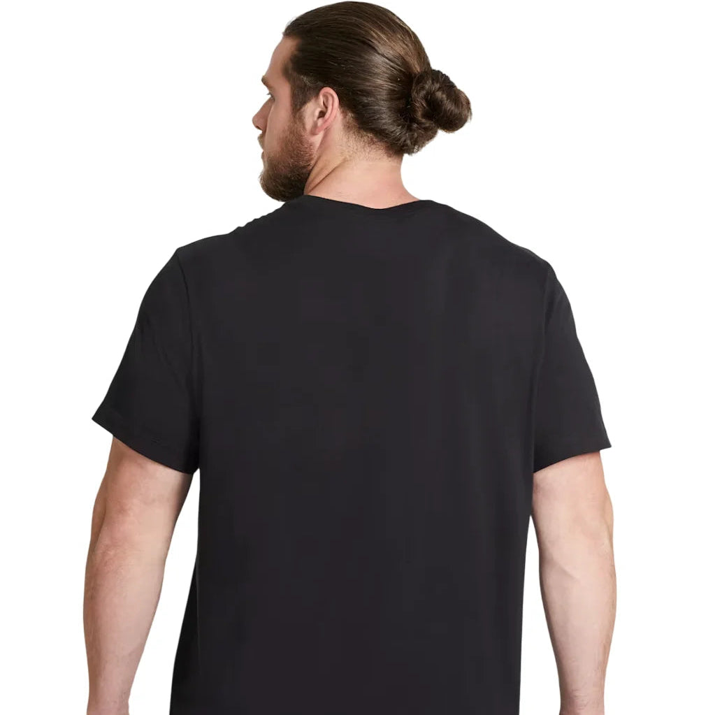 Man wearing Nike Sportswear Club T-Shirt in black/white — 100% cotton crew-neck with embroidered Futura logo on chest, relaxed fit for everyday wear.