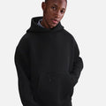 Nike Tech Fleece Oversized Hoodie in black, with oversized silhouette, kangaroo pocket, and premium heavyweight fleece for modern street style.