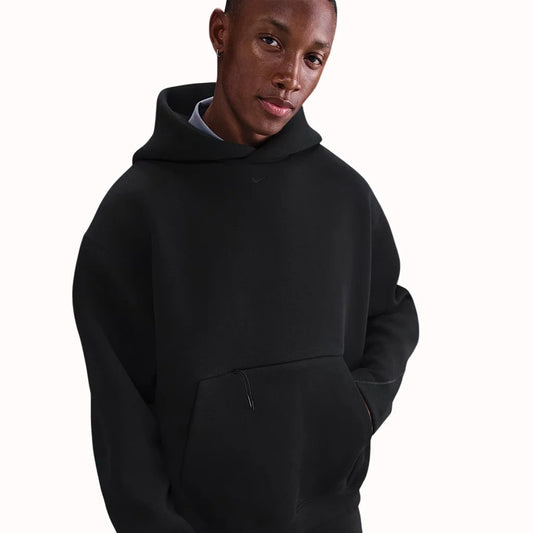 Nike Tech Fleece Oversized Hoodie in black, with oversized silhouette, kangaroo pocket, and premium heavyweight fleece for modern street style.
