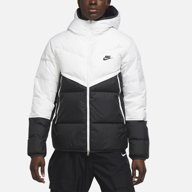 Man wearing white shield coat - wind- and water-resistant full-zip outer jacket with hood, designed for cold weather protection and modern urban style.