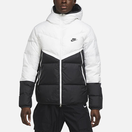 Man wearing white shield coat - wind- and water-resistant full-zip outer jacket with hood, designed for cold weather protection and modern urban style.