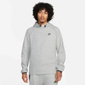Model wearing the Tech Fleece Men’s Pullover Hoodie in grey — breathable fleece fabric with a clean, minimalist look and signature pullover design.