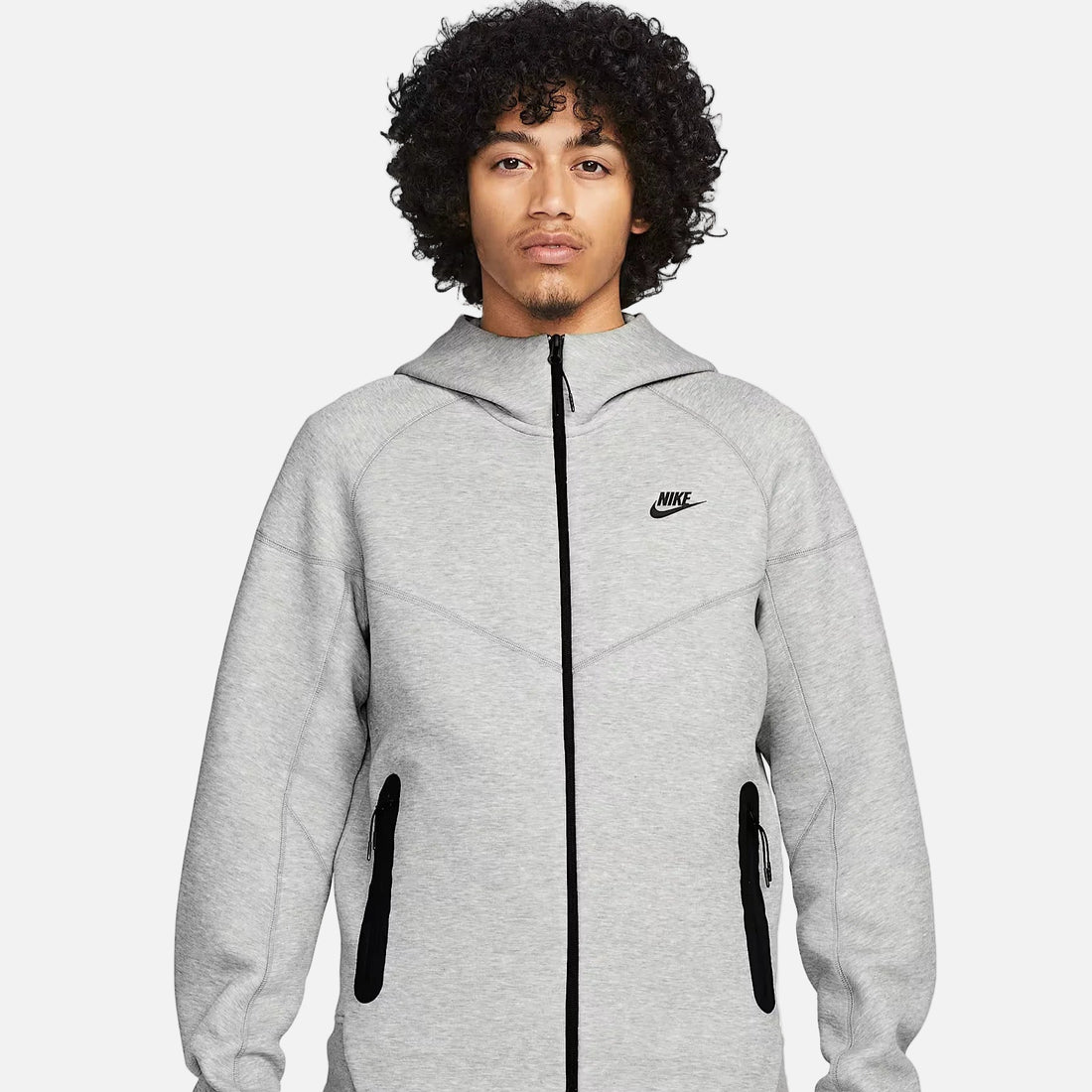 Nike Sportswear Tech Fleece Windrunner Men’s Full-Zip Hoodie in light grey, featuring black zipper, front pockets, and slim modern fit.