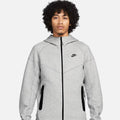 Nike Sportswear Tech Fleece Windrunner Men’s Full-Zip Hoodie in light grey, featuring black zipper, front pockets, and slim modern fit.