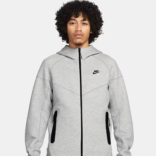 Nike Sportswear Tech Fleece Windrunner Men’s Full-Zip Hoodie in light grey, featuring black zipper, front pockets, and slim modern fit.