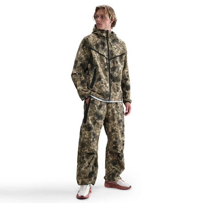 Tech Dri-FIT Woven Camo Windrunner Jacket and Loose-Fit Pants set in full camo print, oversized design blending performance and streetwear style.