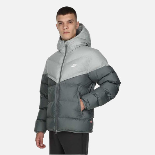 Model wearing Nike Windrunner PrimaLoft Storm-FIT Hooded Puffer Jacket in black – windproof woven shell, water-repellent finish and PrimaLoft ThermoPlume® insulation for cold weather.