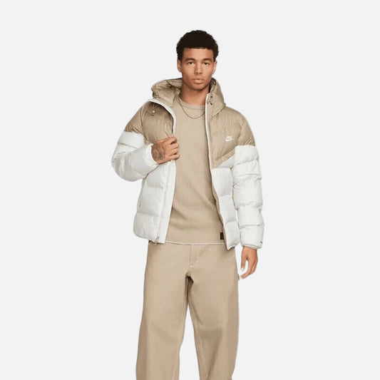 Model wearing Nike Windrunner PrimaLoft Storm-FIT Hooded Puffer Jacket in black – windproof woven shell, water-repellent finish and PrimaLoft ThermoPlume® insulation for cold weather.