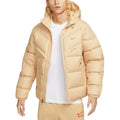 Man wearing Nike Windrunner Storm-FIT Jacket in beige – hooded full-zip jacket with wind- and water-resistant shell and sleek urban design.