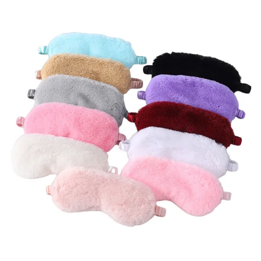 These soft, plush sleep masks are perfect for blocking out light and improving sleep quality. Available in a variety of colors, they offer a comfortable fit with adjustable straps. The gentle, fuzzy material ensures a soothing experience for your eyes, making it ideal for naps or travel. Lightweight and portable, they are a great addition to your bedtime routine. Perfect for anyone looking for a relaxing, undisturbed sleep.