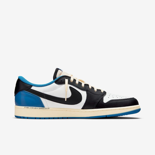 Air Jordan 1 Low Fragment Blue sneaker featuring white leather upper, black overlays, royal blue heel panel, cream midsole, and low-top classic Jordan silhouette.