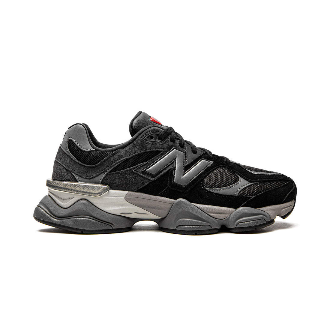 9060 Black Castlerock sneaker featuring breathable mesh upper in black and grey tones, suede overlays, chunky cushioned sole, and modern Y2K-inspired design. 