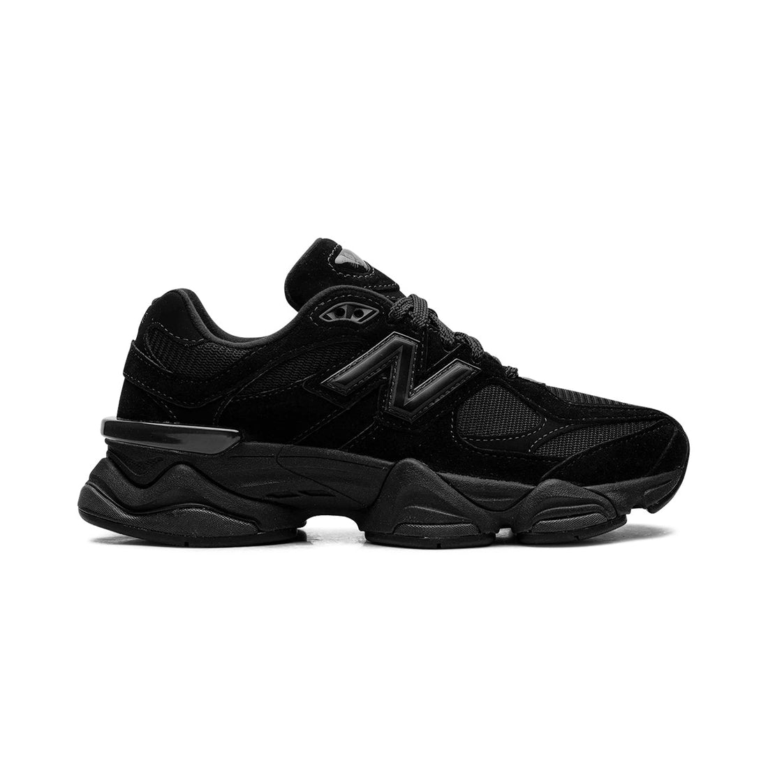 9060 Triple Black sneaker featuring breathable mesh upper in all-black tones, suede overlays, chunky cushioned sole, and modern Y2K-inspired design.
