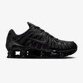 Nike Shox TL Triple Black sneaker featuring full-length Shox cushioning columns, breathable black mesh upper, molded overlays, and sleek monochrome athletic design.
