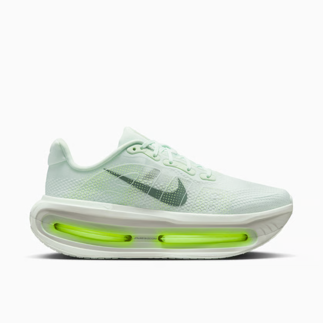 Vomero Premium Barely Volt sneaker featuring breathable black mesh upper, bright volt green accents, cushioned sole with visible Air units, and modern performance-inspired design.