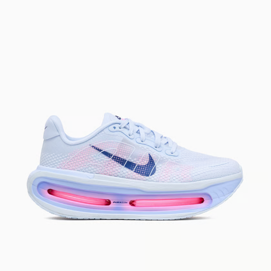 Vomero Premium Blue Tint sneaker featuring breathable mesh upper in light blue tones, cushioned sole with visible Air units, and modern performance-inspired design.