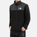 Front view of men’s black fleece jacket with full zip, high collar and woven chest panel.