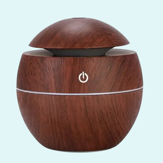 This stylish USB-powered air humidifier features a sleek wooden design, perfect for adding moisture to the air and improving room ambiance. Its compact size makes it ideal for desks, bedrooms, or office spaces. Easy to use with a simple one-touch button, it helps create a more comfortable and refreshing environment by preventing dryness.
